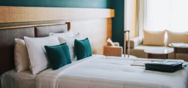 What are the best amenities offered by hotels near CMC Vellore for long stay?