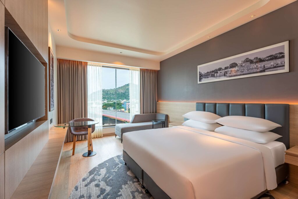 How can I compare hotel room options in Vellore before booking?